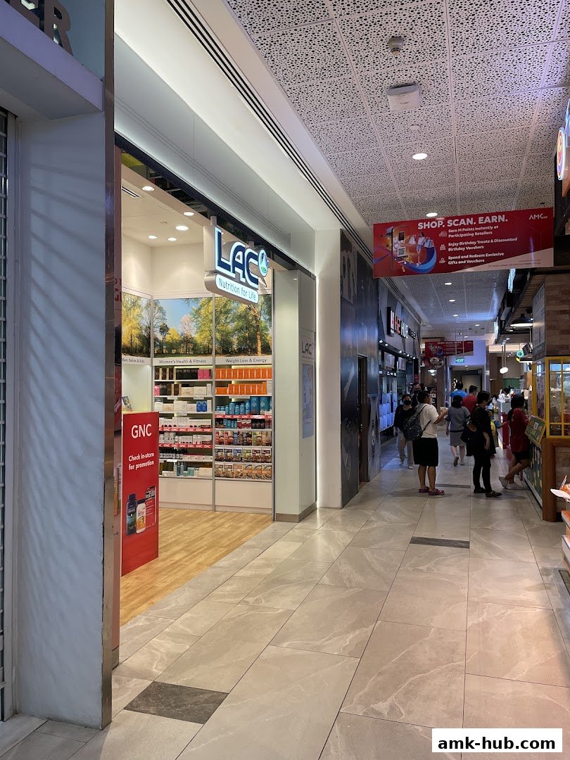 The exterior of the LAC Nutrition For Life shop, showcasing shelves stocked with health products.