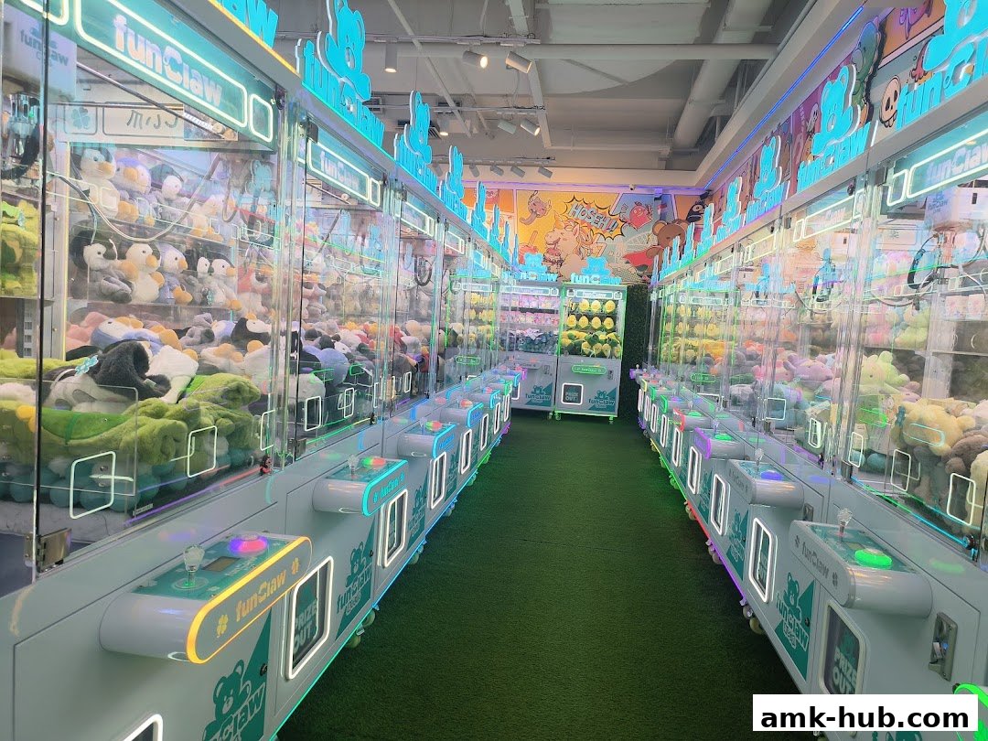 An aisle of brightly lit claw machines filled with plush toys at Fun Claw.