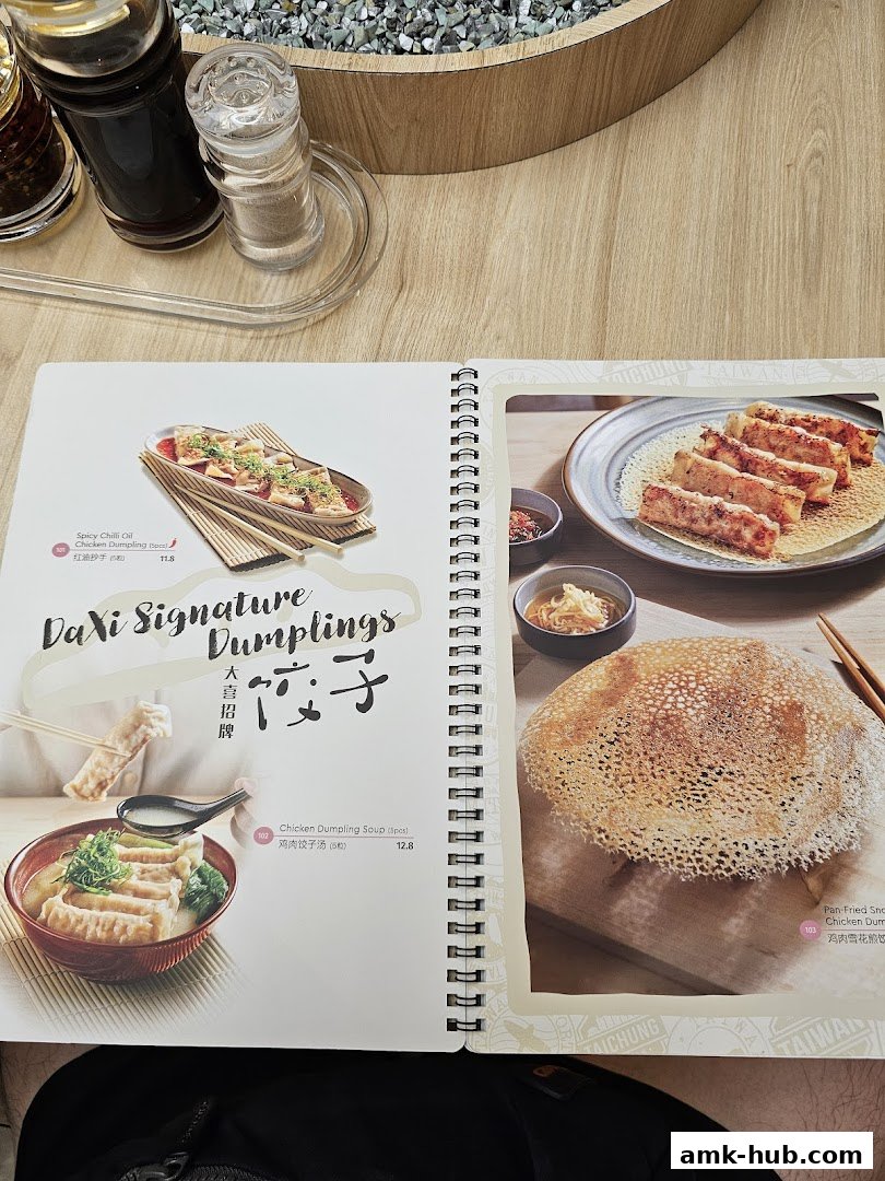 A menu showcasing DaXi Signature Dumplings with enticing food photography.