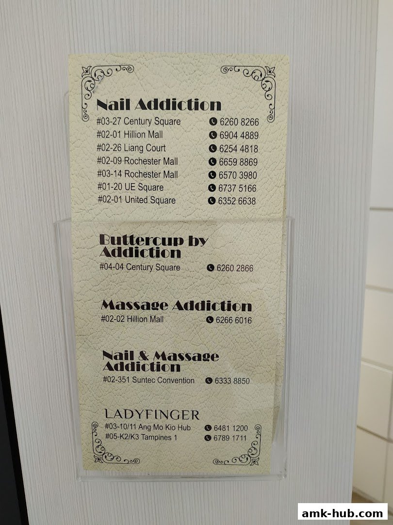 A flyer displaying contact information for various nail and massage services.