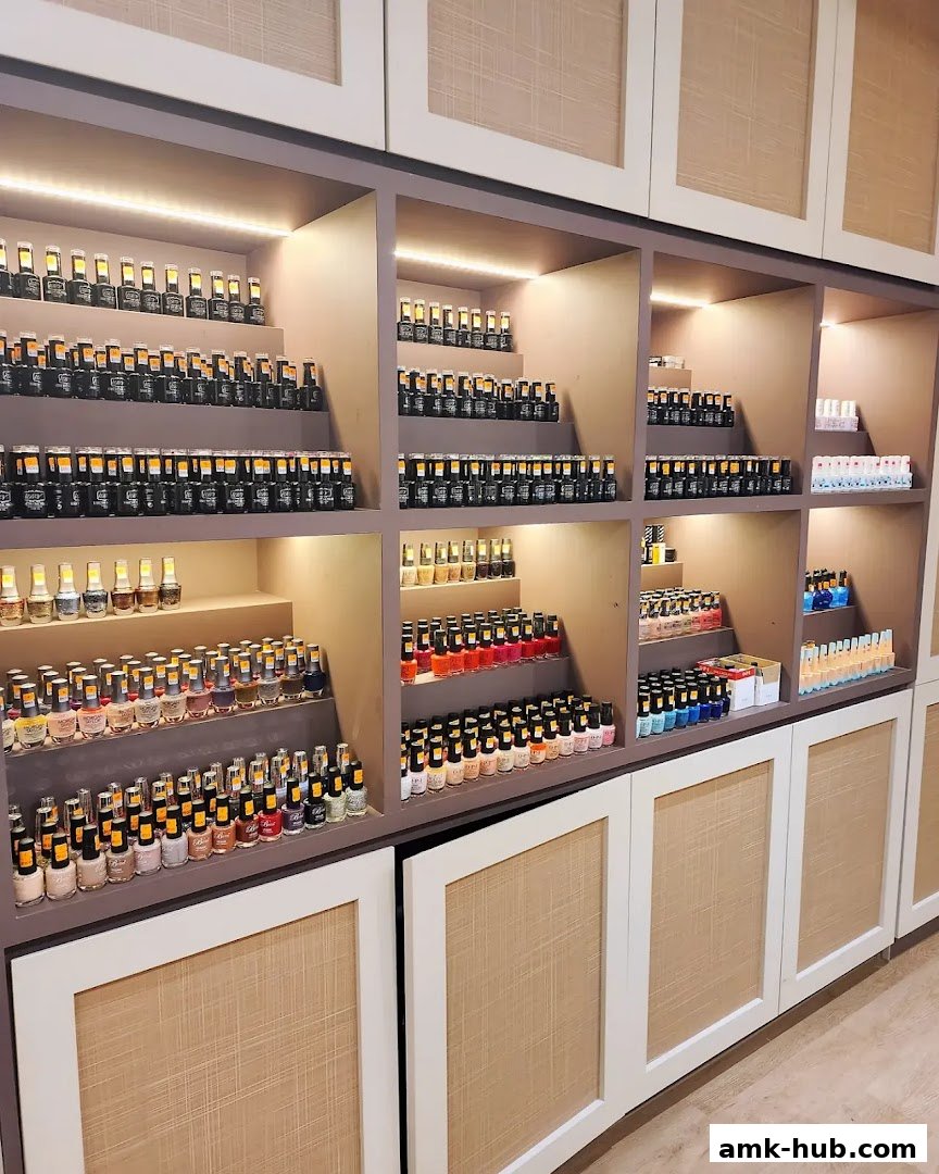 A well-lit display of numerous nail polish bottles organized on shelves.