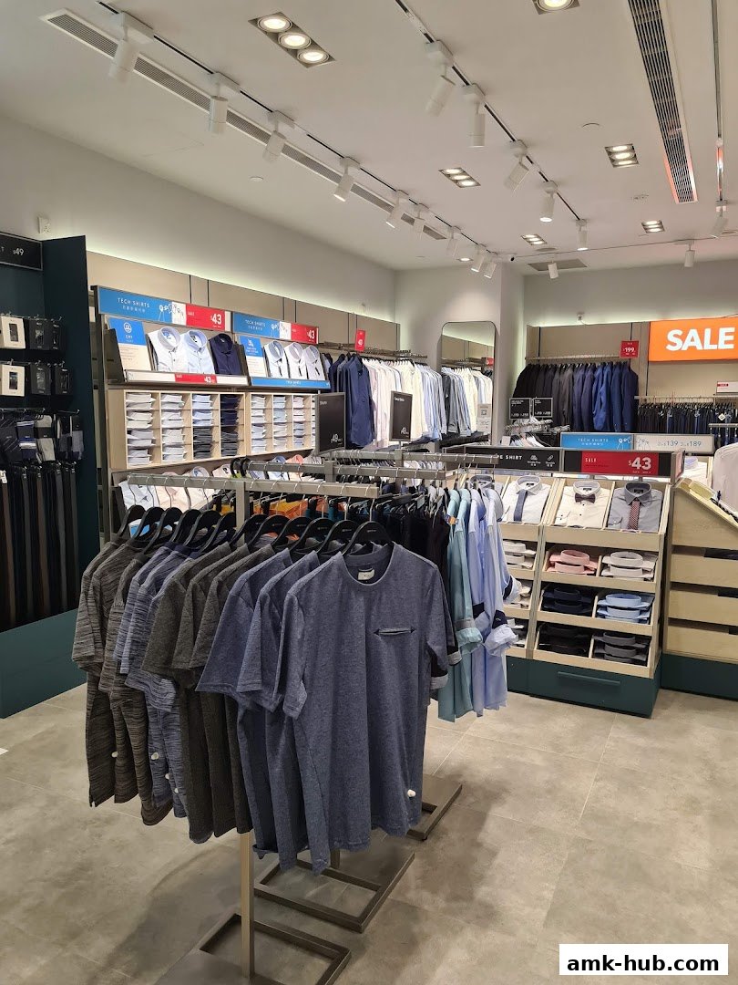 Interior view of a G2000 clothing store showcasing men's shirts and t-shirts.