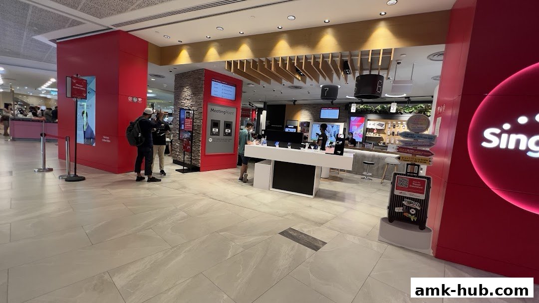 The entrance of a Singtel shop with displays of phones and promotional materials.