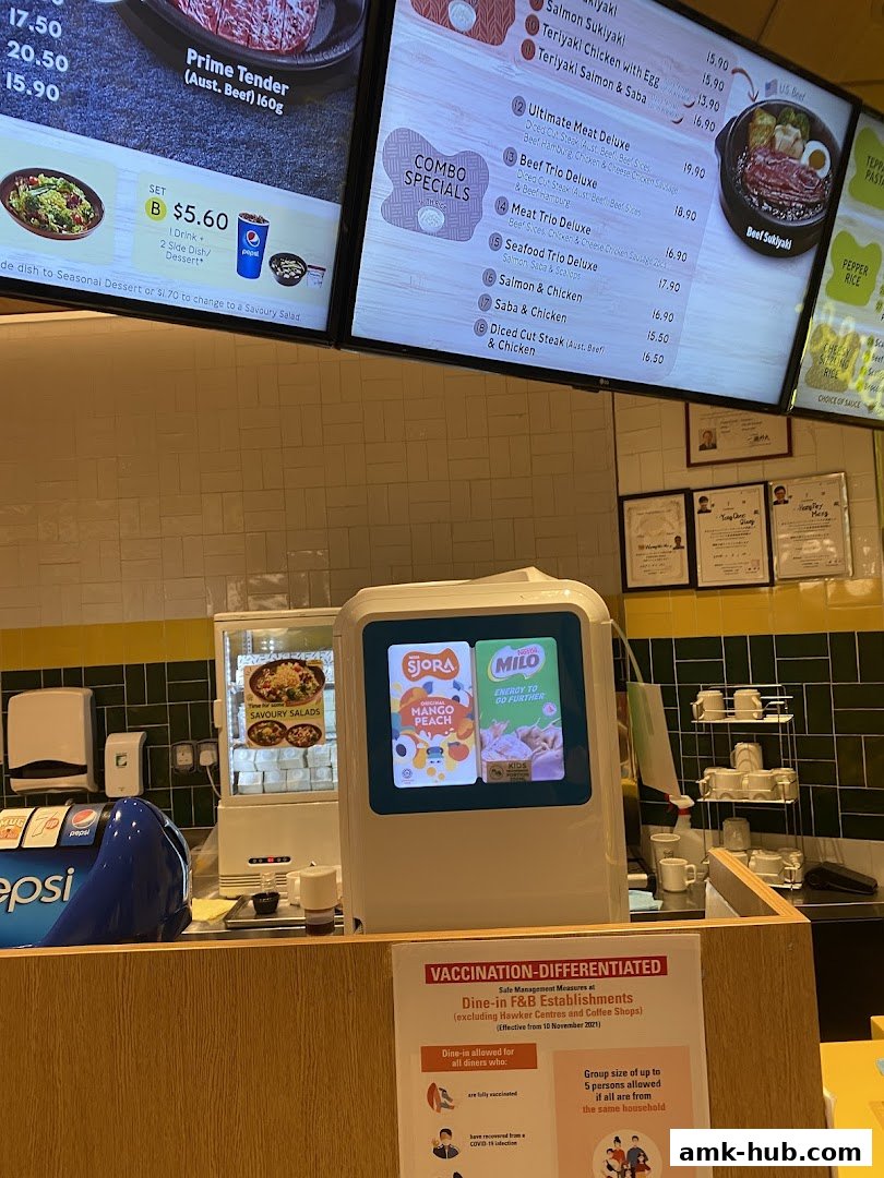A digital menu board displaying various meal options and combo specials at Pepper Lunch.