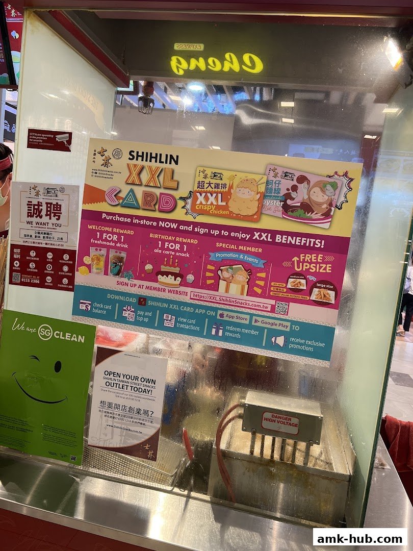A display board for Shihlin Taiwan Street Snacks promoting their XXL Card and membership benefits.