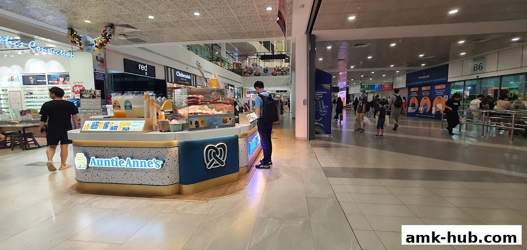 A customer orders at the Auntie Anne's pretzel stall in a shopping mall.