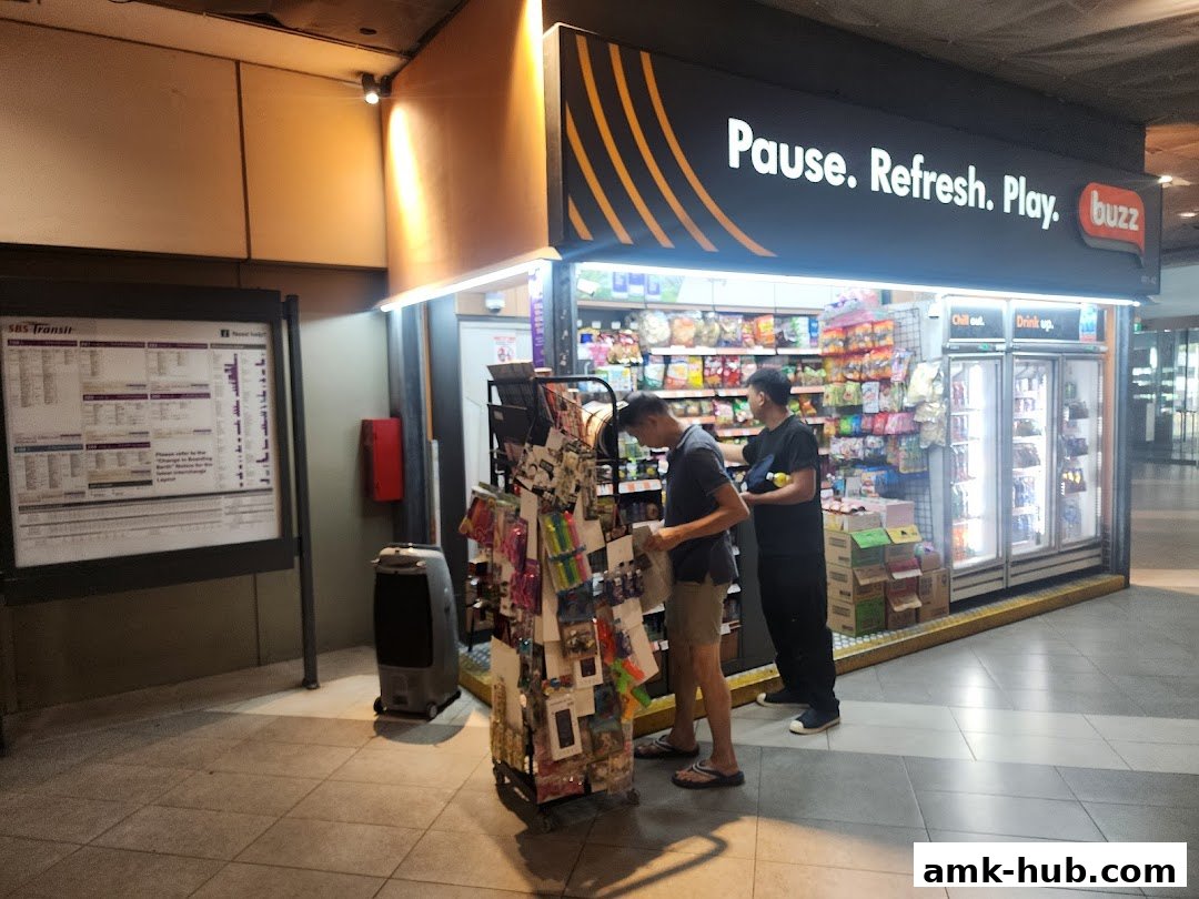 Two people are browsing items at a convenience store called Buzz.