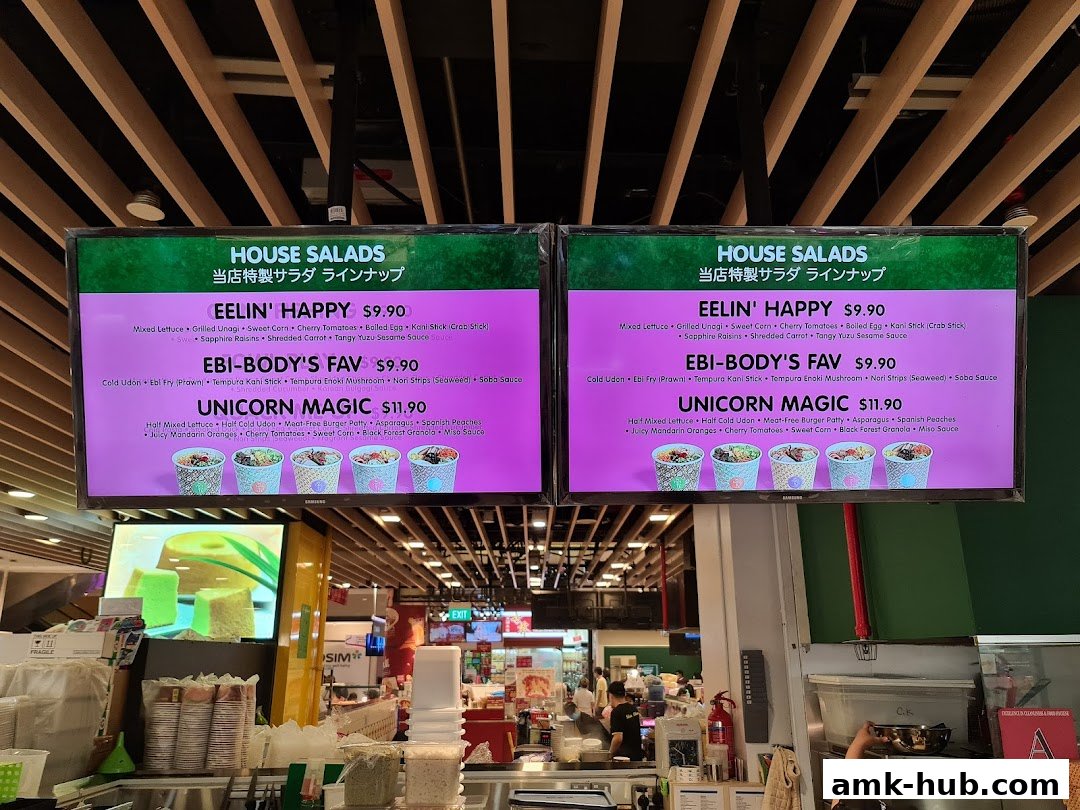 Digital menu boards displaying house salad options with ingredients and prices.