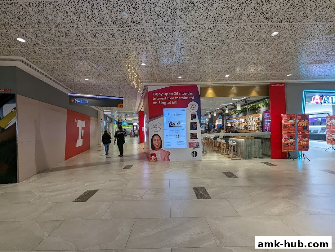 The Singtel shop entrance with promotional displays and a counter inside.