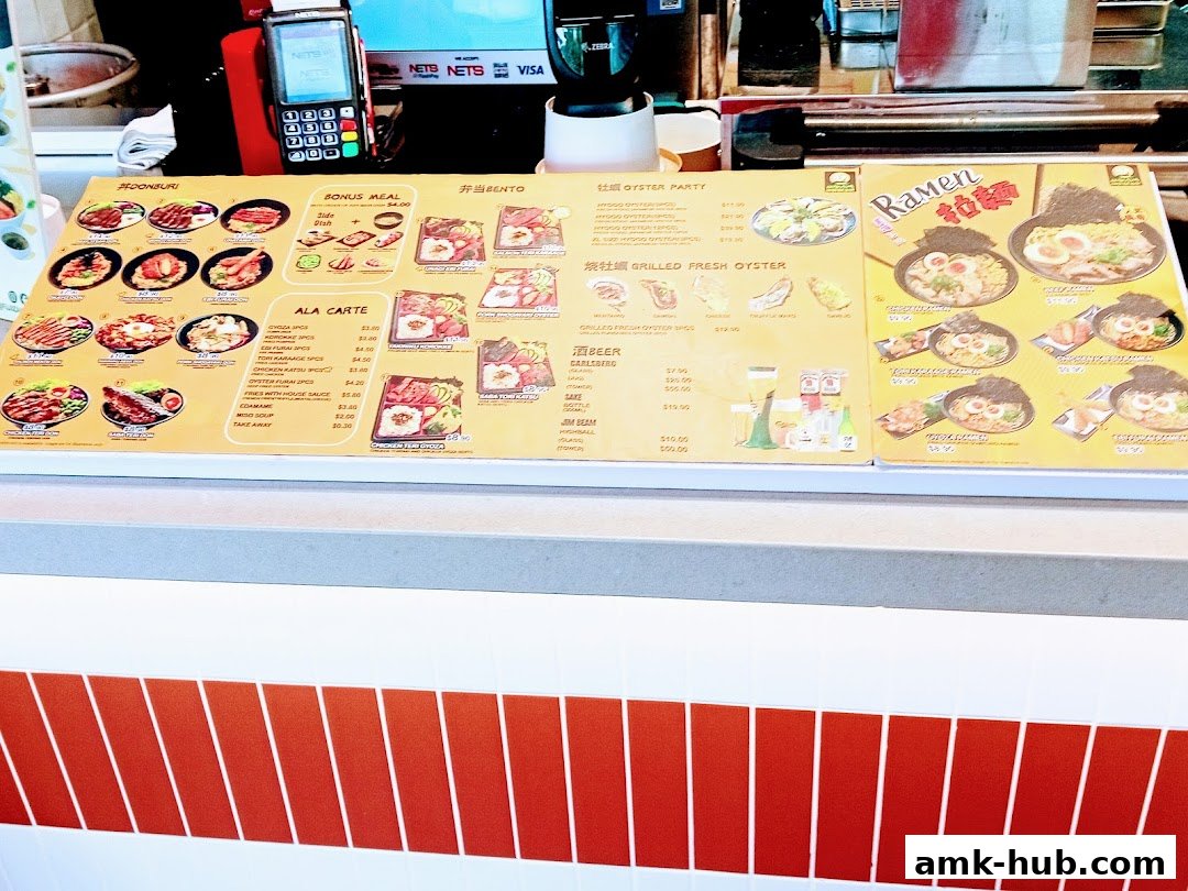 A menu board displaying various Japanese dishes including Donburi, Bento, Oysters, and Ramen.