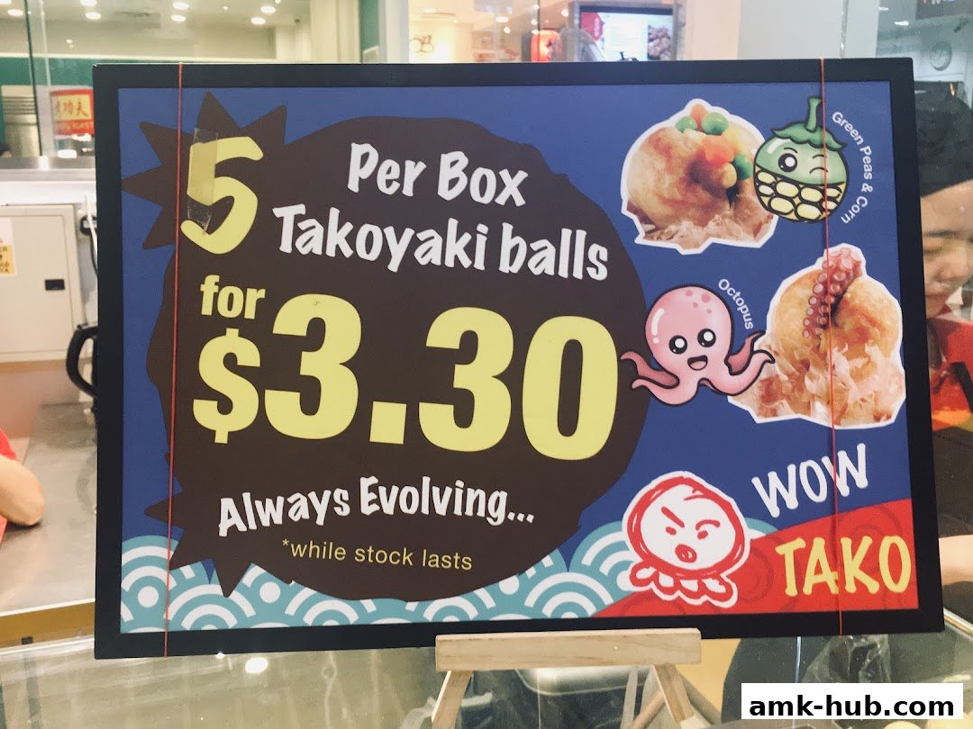 A sign advertising 5 Takoyaki balls for $3.30 from Wow Tako.