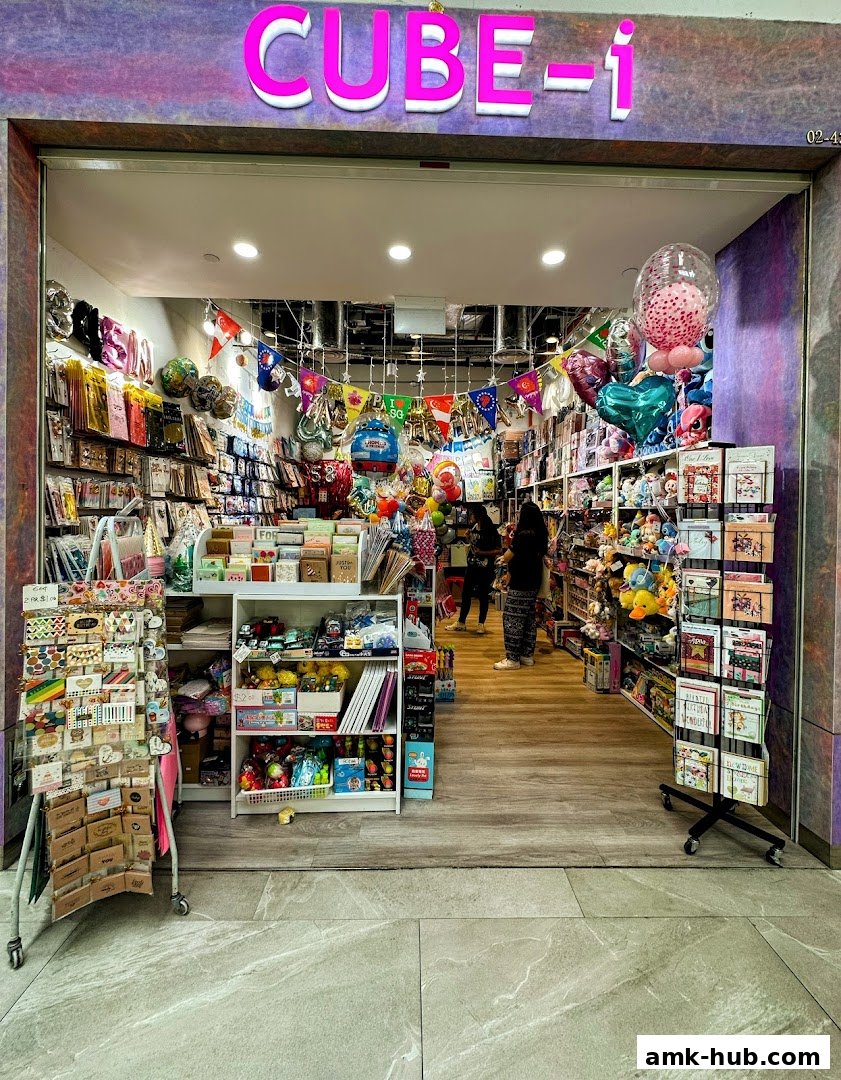 The entrance of CUBE-i AMK Hub, a shop filled with balloons, cards, and gifts.