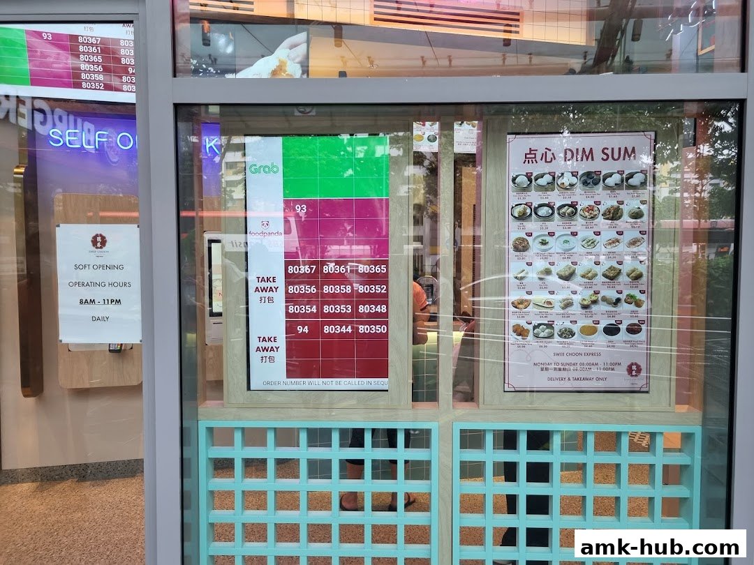 A restaurant storefront displaying a dim sum menu and takeaway order numbers.