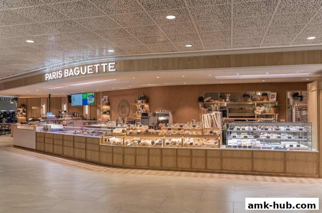 A wide view of the Paris Baguette bakery counter filled with various pastries and cakes.