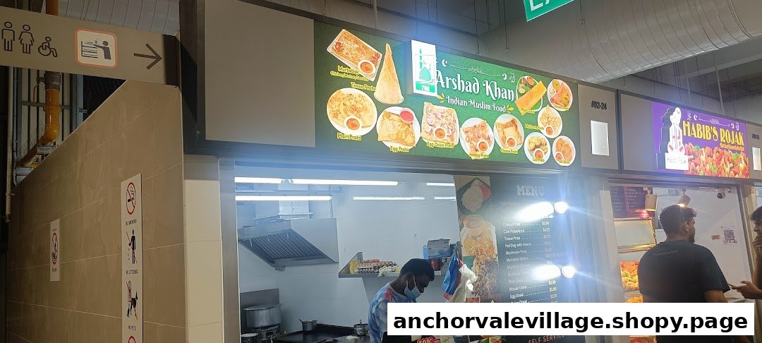 A food stall named '786 Arshad Khan Indian Muslim Food' displaying its menu board with various dishes and prices.