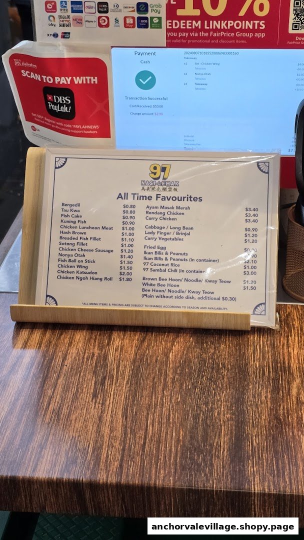 A close-up of 97 Nasi Lemak's menu board displaying "All Time Favourites" and payment options.