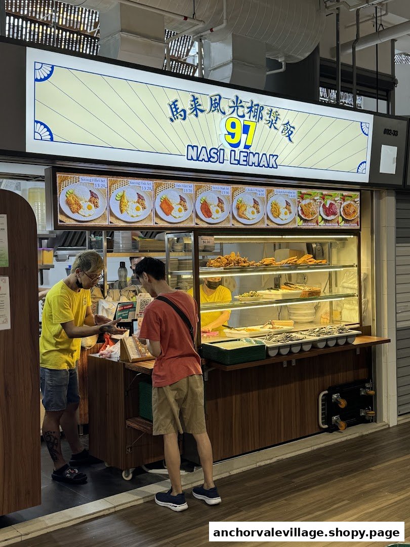 A bustling Nasi Lemak stall with customers ordering and a vibrant food display.
