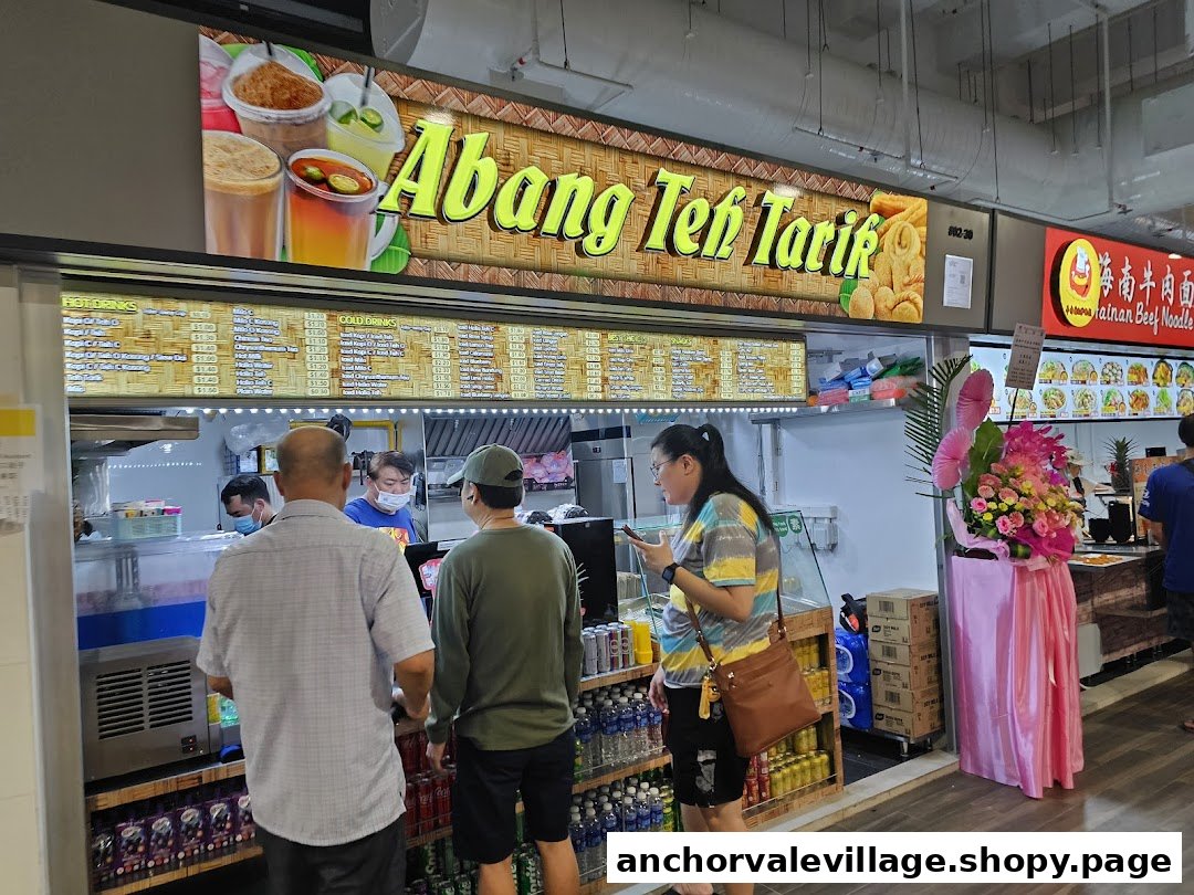 Customers ordering from the extensive hot and cold beverage menu at Abang Teh Tarik stall.