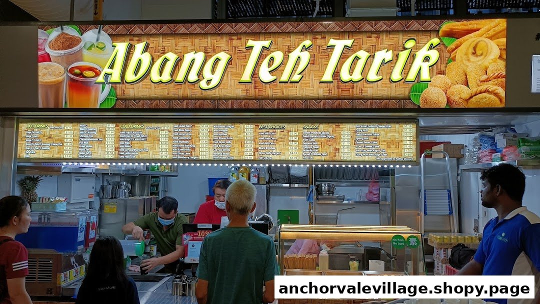 A bustling food stall named Abang Teh Tarik with a visible menu, staff, and customers.