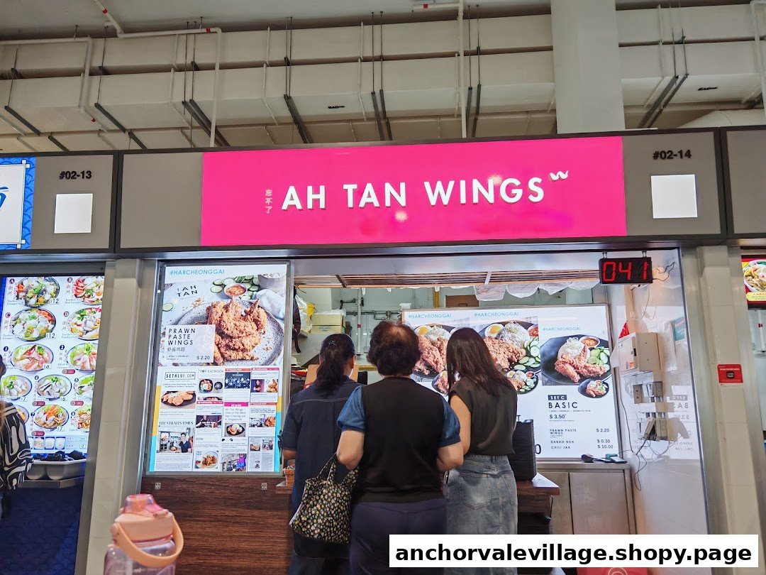 Customers ordering at Ah Tan Wings, featuring their prawn paste wings menu.
