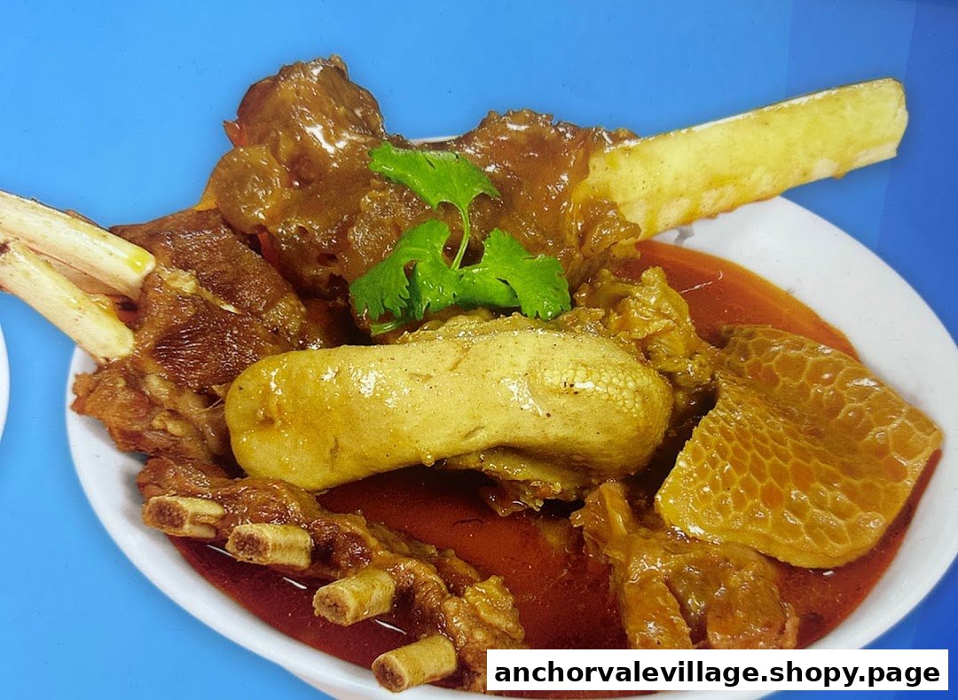 A close-up of a rich, hearty mutton soup or curry with various cuts of meat and bones, garnished with cilantro.