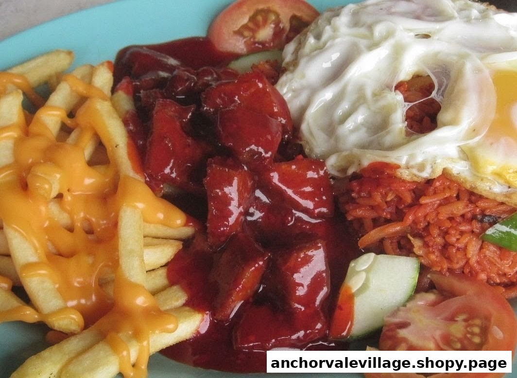 A vibrant plate featuring cheesy fries, red sauce chicken, fried rice, and a fried egg.