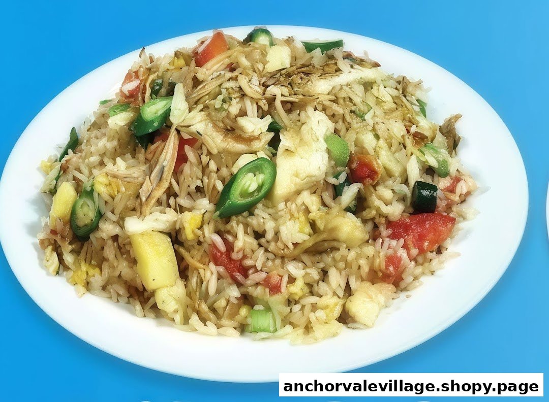 A vibrant plate of fried rice with vegetables, egg, and possibly fish or chicken, on a white plate.