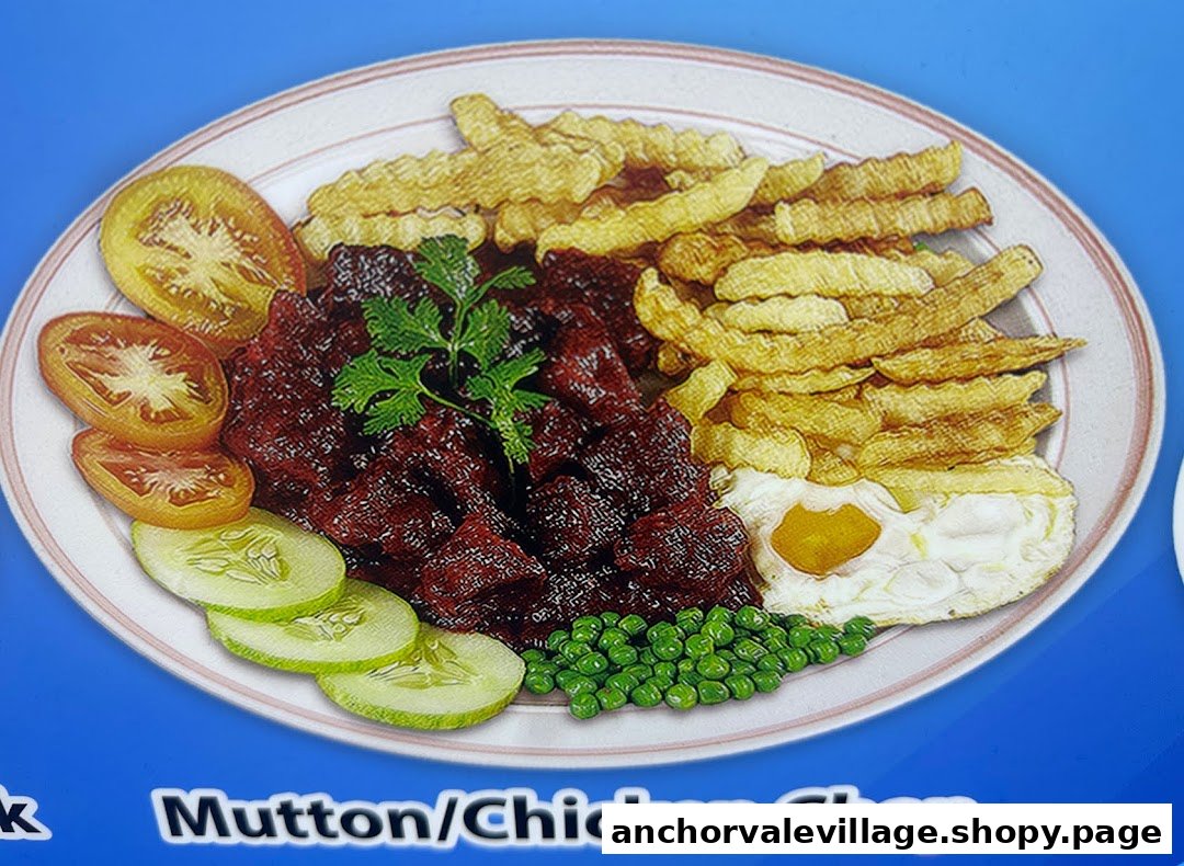 A vibrant plate featuring mutton/chicken chop, crispy fries, fresh vegetables, and a fried egg.