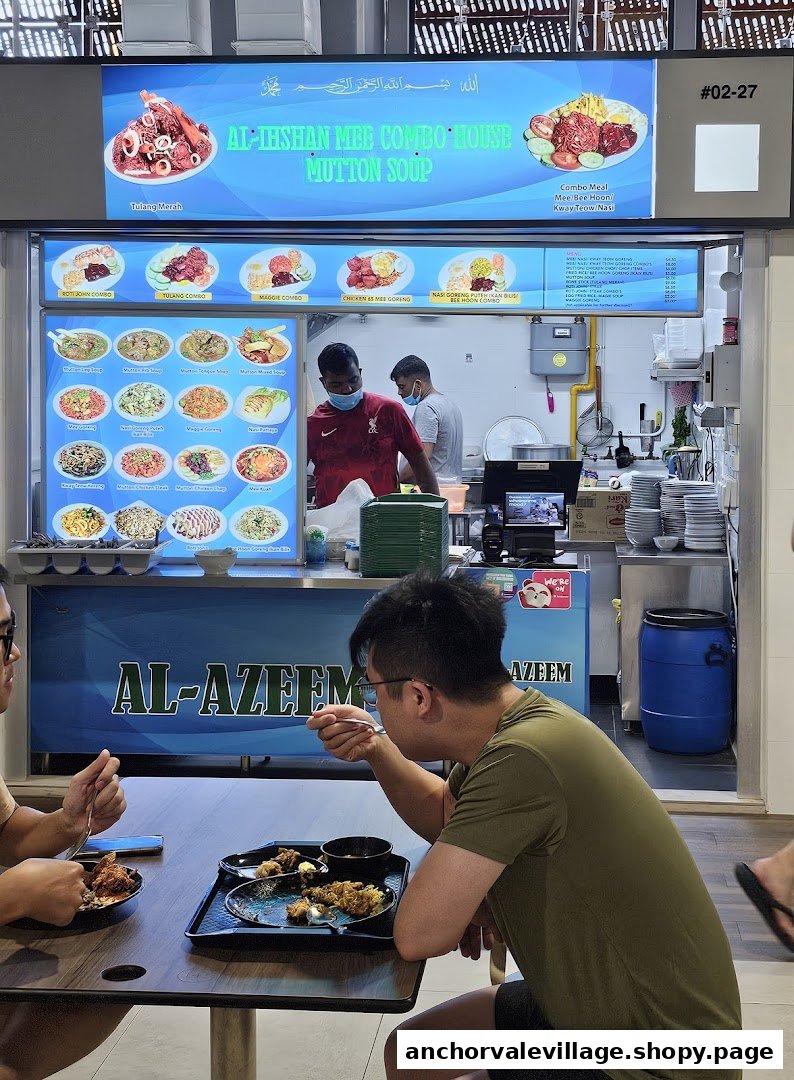 Customers dine at Al-Ihshan Combo House, featuring its menu and busy kitchen.