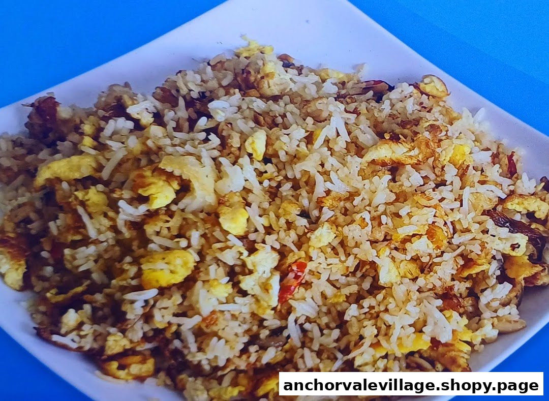 A close-up shot of a delicious plate of fried rice with scrambled egg and other ingredients.