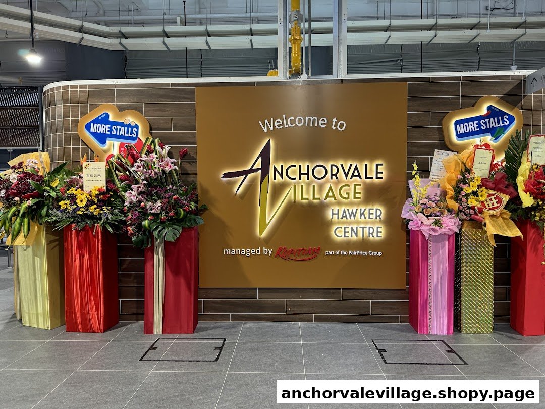Welcome sign for Anchorvale Village Hawker Centre, adorned with vibrant floral arrangements and 'More Stalls' signs.