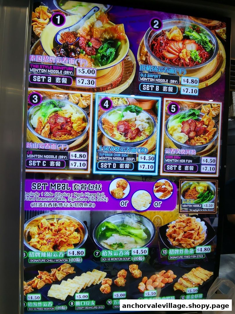 A brightly lit menu board showcasing various wonton noodle dishes and side orders with prices.