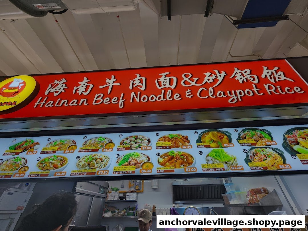 A vibrant menu board displaying various Hainan Beef Noodle and Claypot Rice dishes with prices.
