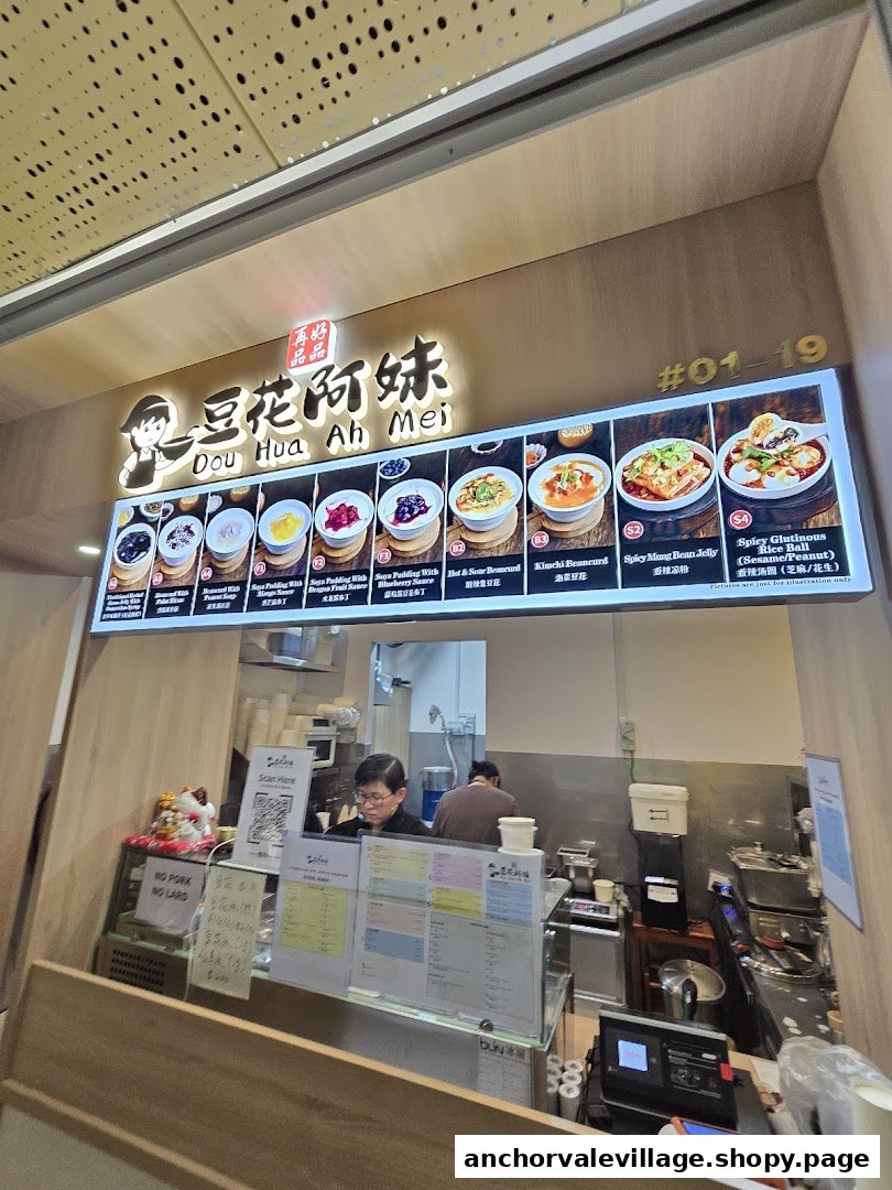 A vibrant digital menu board showcasing various soya pudding and specialty dishes at Dou Hua Ah Mei.