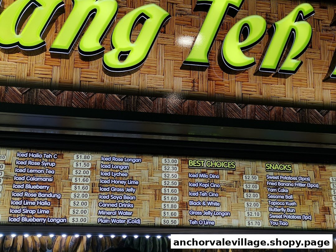 A vibrant menu board displaying a variety of refreshing iced drinks and local snacks.