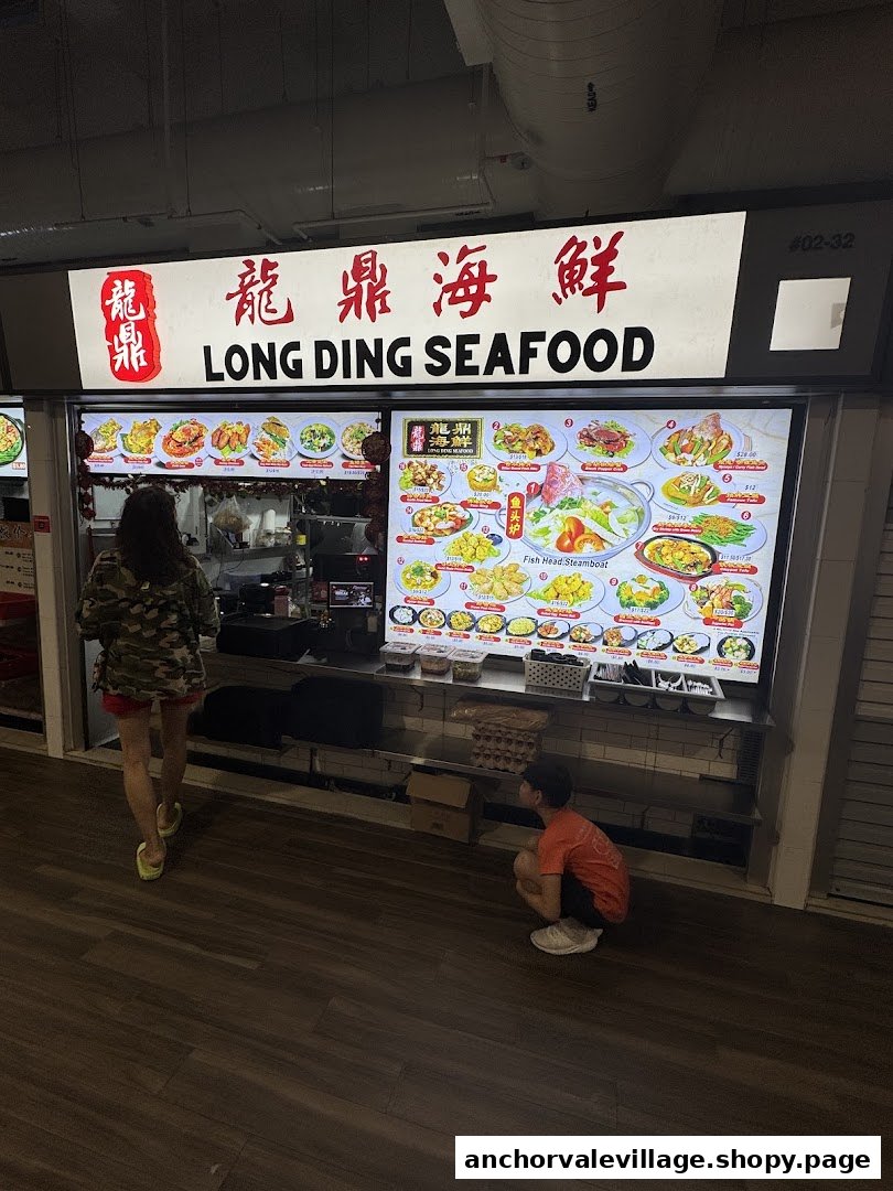Front view of Long Ding Seafood hawker stall with a large digital menu display.