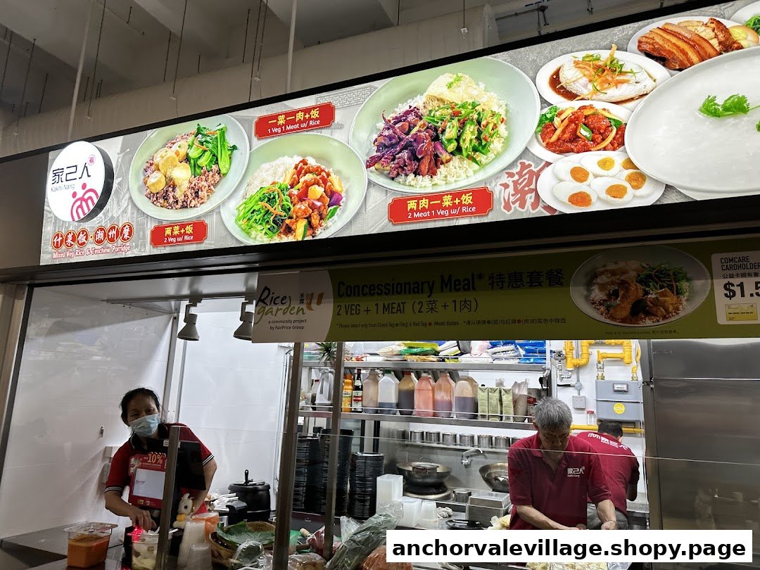 A hawker stall with a large menu board displaying various rice and porridge dishes, with staff preparing food.
