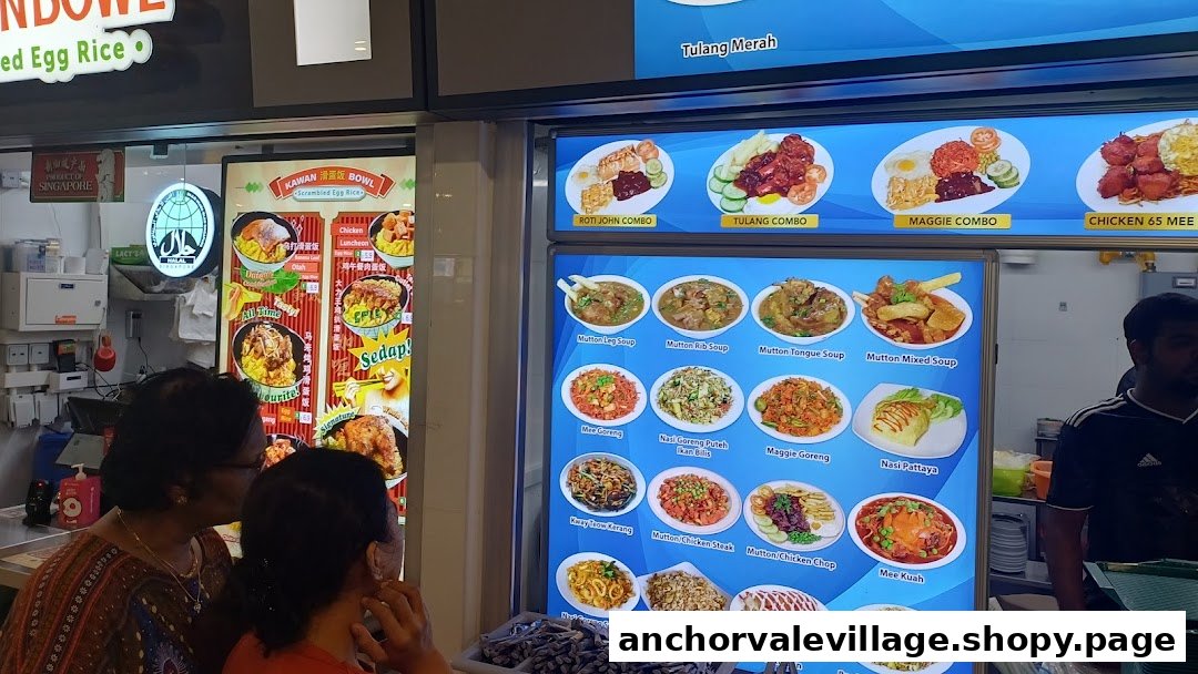 Customers viewing large illuminated menu boards displaying various dishes and prices at a hawker stall.