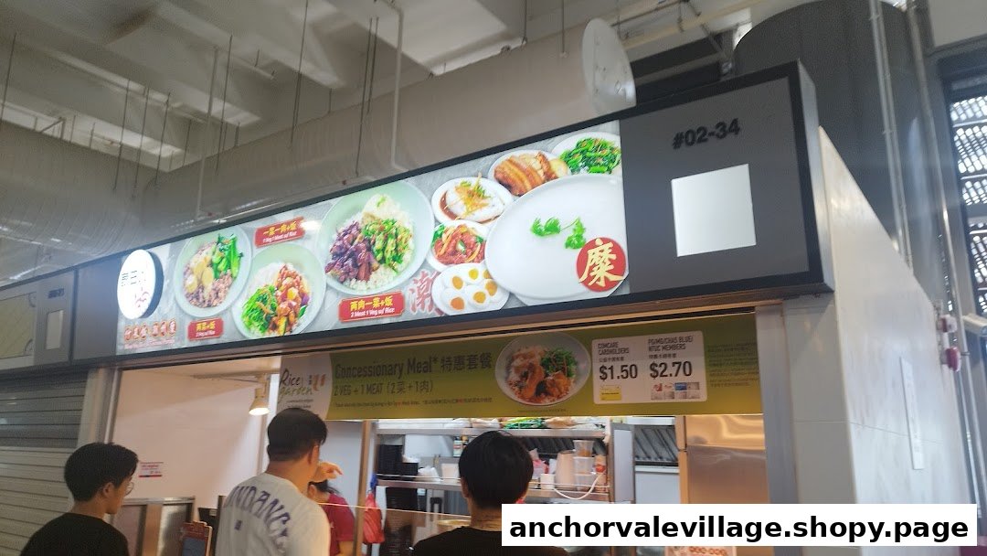A hawker stall's menu board displaying various rice and meat dishes, with a special concessionary meal offer.