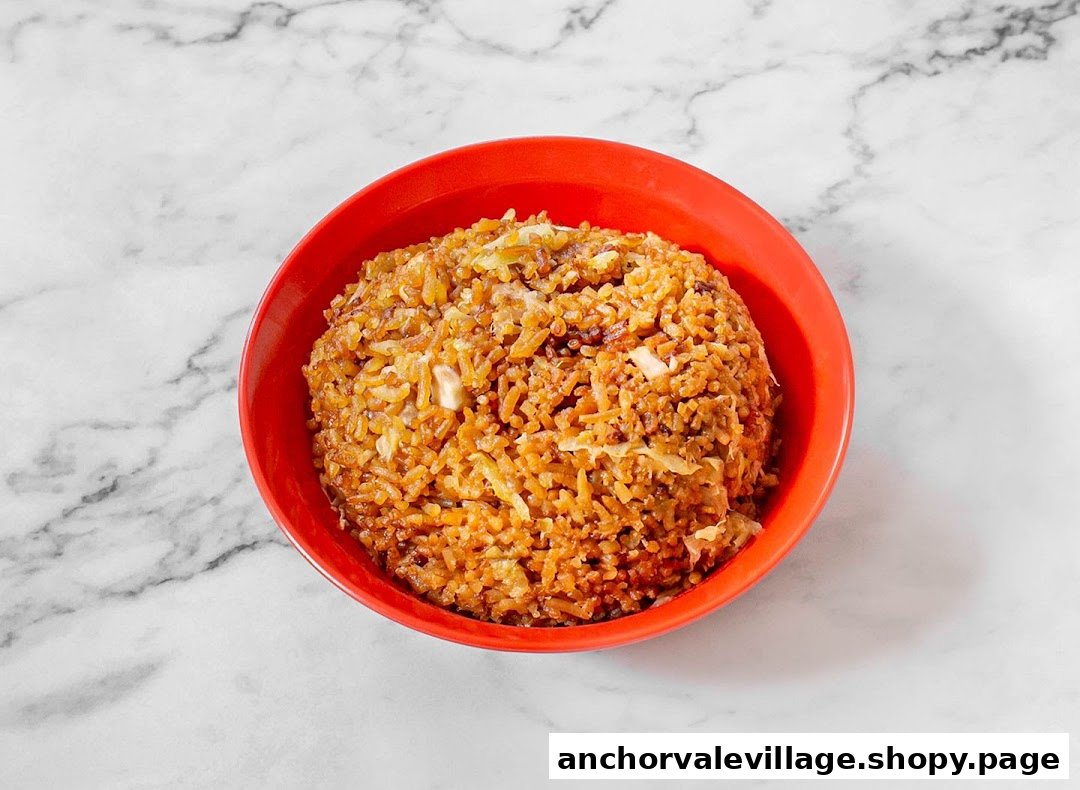 A vibrant red bowl filled with savory fried rice, featuring visible ingredients.