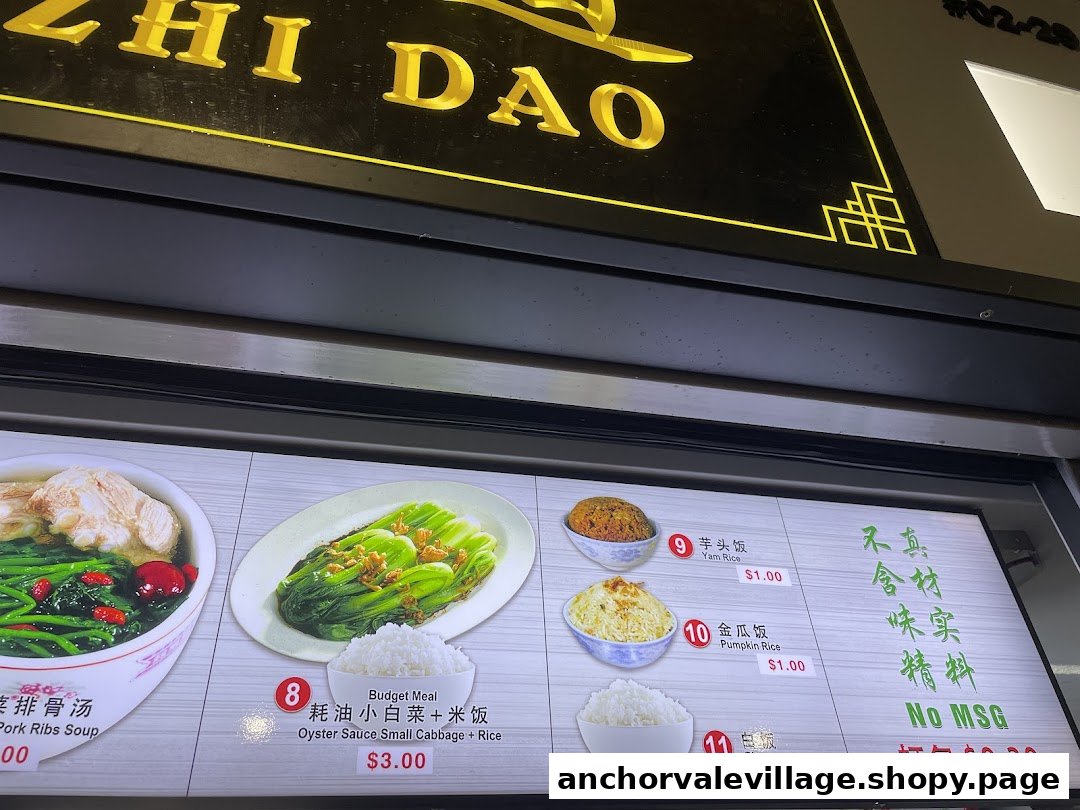 A brightly lit menu board displaying various soup and rice dishes with prices.