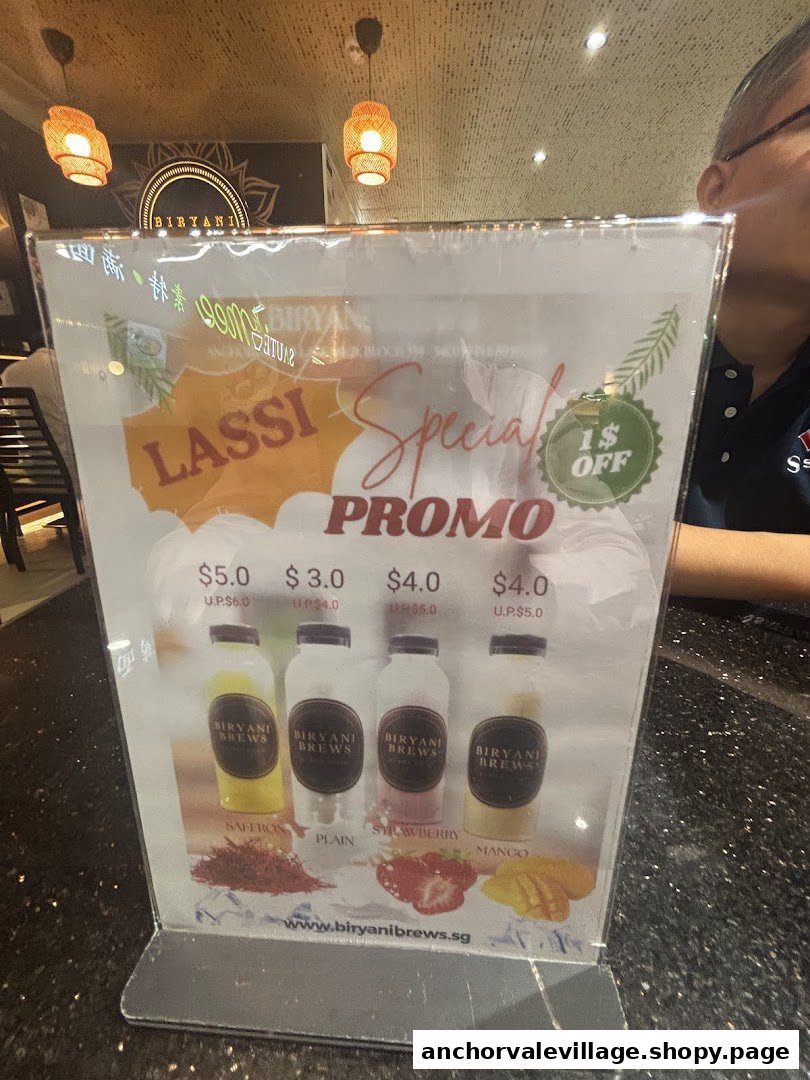 A promotional display for Lassi drinks at Biryani Brews, showing various flavors and prices.