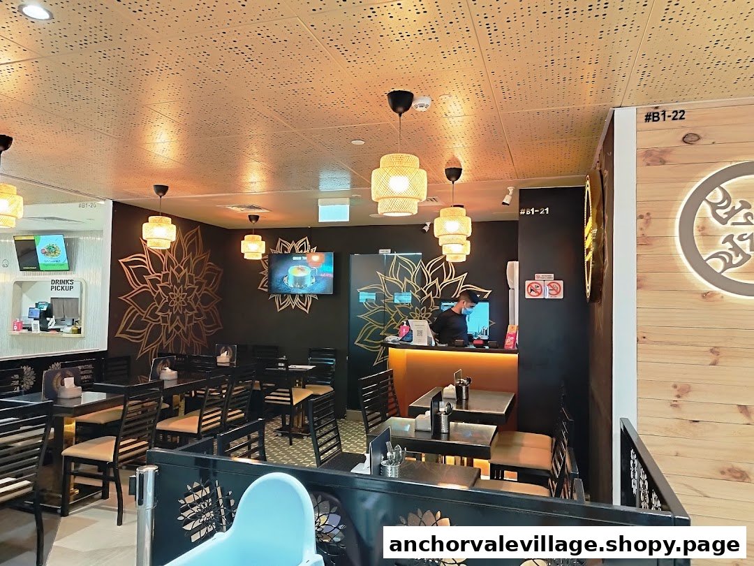 Interior view of Biryani Brews, showcasing its modern dining area with decorative walls and a service counter.