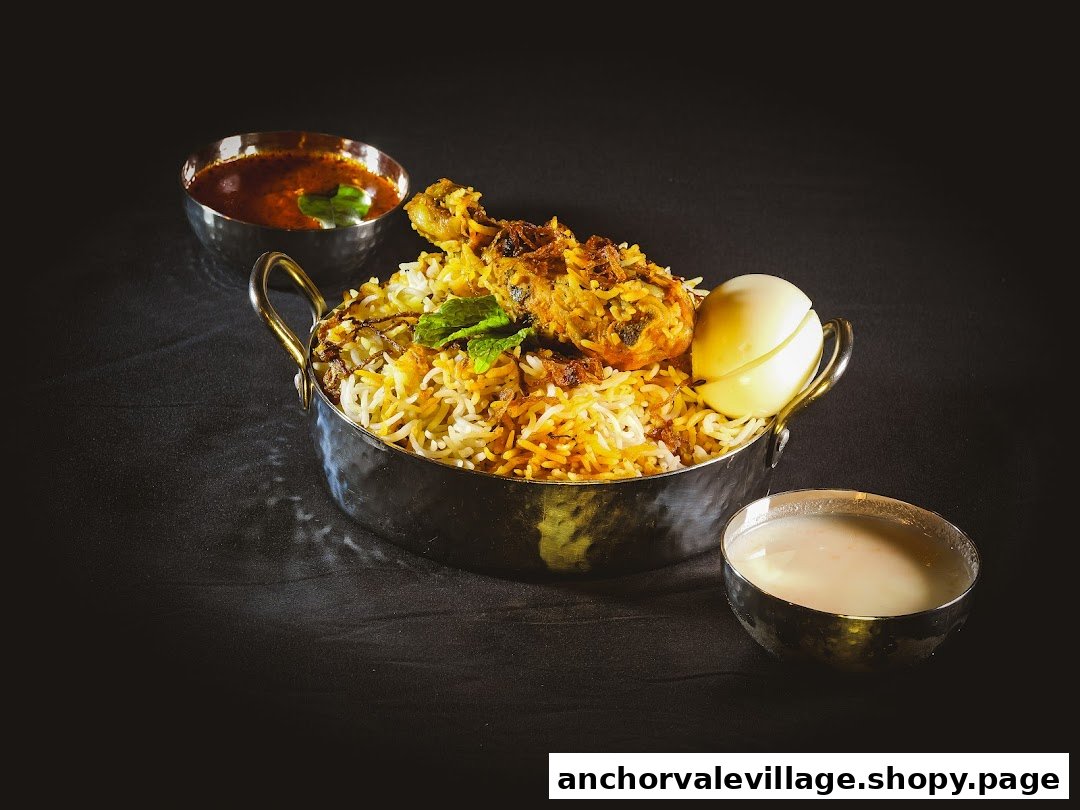A vibrant bowl of chicken biryani with a boiled egg, gravy, and raita on a dark background.