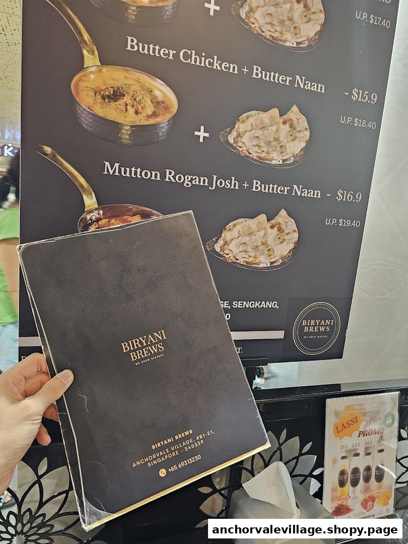 A menu board displaying Biryani Brews' combo meals and a physical menu with contact details.