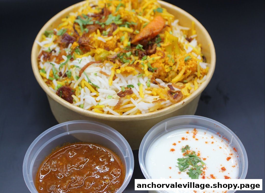 A delicious bowl of biryani with two accompanying side sauces, ready to be enjoyed.