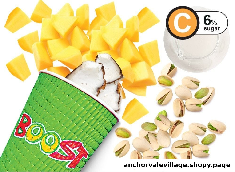 A Boost Juice cup surrounded by fresh mango, coconut, and pistachios, highlighting natural ingredients.