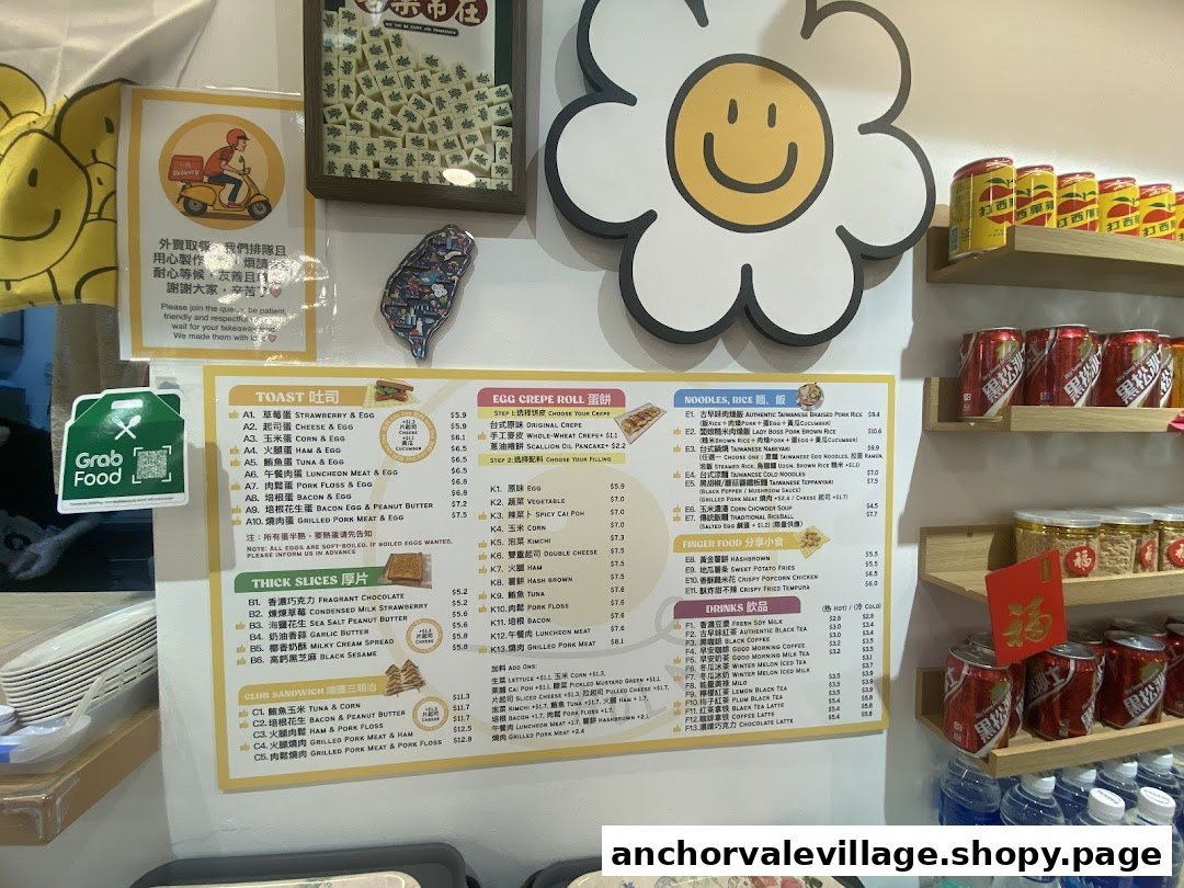 A detailed menu board displaying various breakfast and meal options, including toasts, crepes, noodles, and drinks.