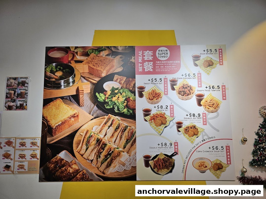 A vibrant menu board showcasing various breakfast and snack set meals with prices and images.