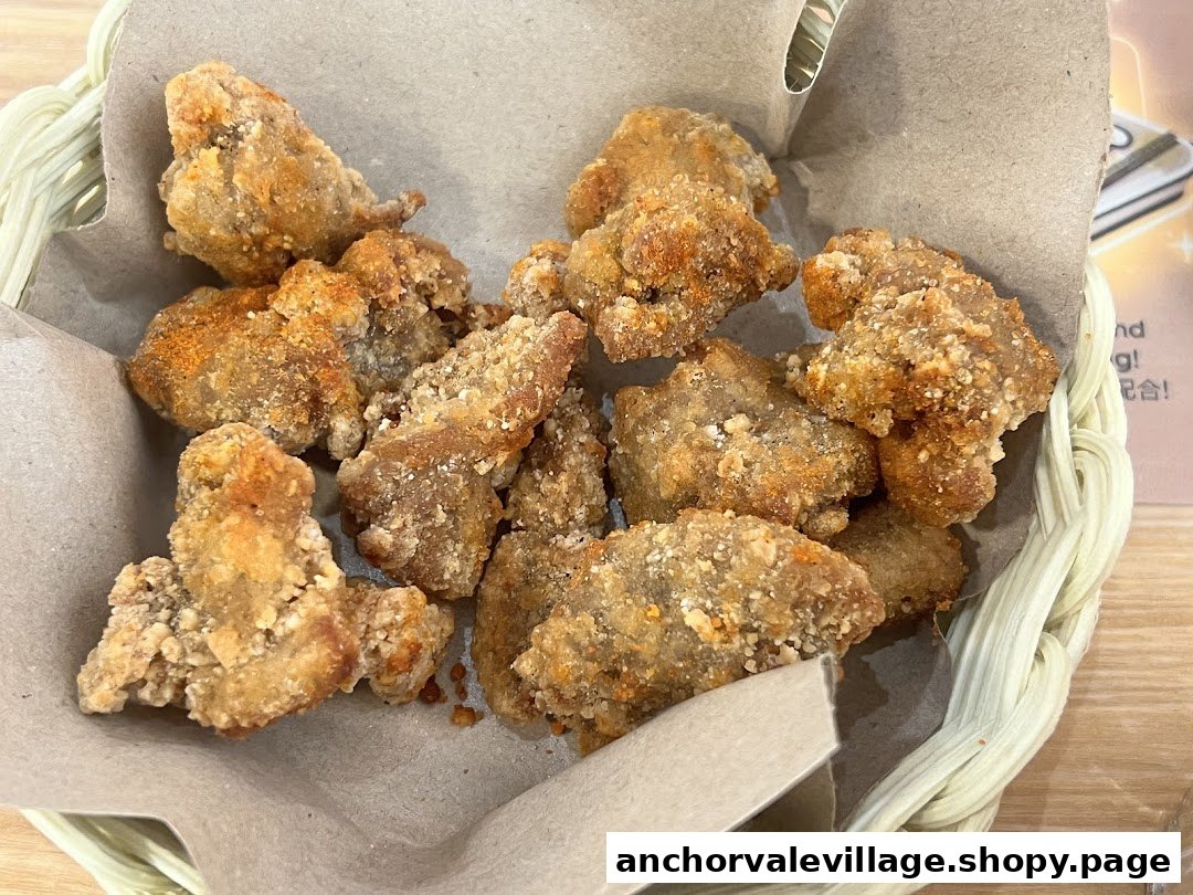 A basket filled with golden-brown, crispy fried chicken pieces, likely a popular snack.